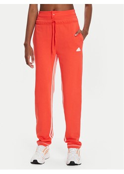 adidas Spodnie dresowe Dance All-Gender Versatile IS0897 Pomarańczowy Regular Fit ze sklepu MODIVO w kategorii Spodnie damskie - zdjęcie 181186079