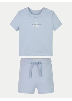 Calvin Klein Jeans Komplet t-shirt i spodenki Monogram Logo IN0IN00319 Błękitny Regular Fit ze sklepu MODIVO w kategorii Komplety niemowlęce - zdjęcie 181187487