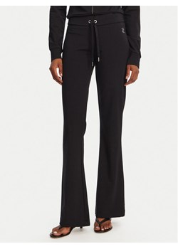Juicy Couture Spodnie dresowe Apollo JCWBJ125311 Czarny Flared Leg ze sklepu MODIVO w kategorii Spodnie damskie - zdjęcie 181187807