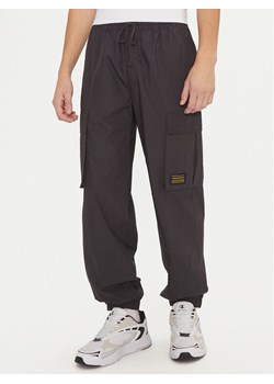 Champion Spodnie dresowe 220415 Czarny Loose Fit ze sklepu MODIVO w kategorii Spodnie męskie - zdjęcie 181190526