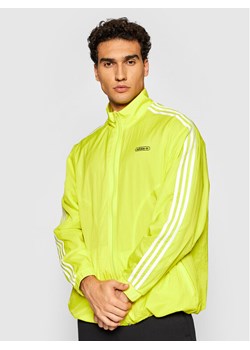 adidas Kurtka przejściowa Reverse Track GN3818 Żółty Regular Fit ze sklepu MODIVO w kategorii Kurtki męskie - zdjęcie 181191475