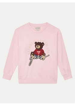 Guess Bluza H5RJ01 KAD74 Różowy Regular Fit ze sklepu MODIVO w kategorii Bluzy dziewczęce - zdjęcie 181193626