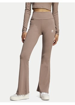 adidas Legginsy Essentials JC9023 Beżowy Flare Fit ze sklepu MODIVO w kategorii Spodnie damskie - zdjęcie 181195586
