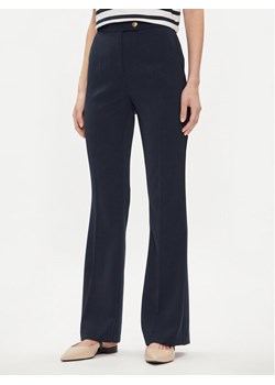 Tommy Hilfiger Spodnie materiałowe Gold Button WW0WW42455 Granatowy Flare Fit ze sklepu MODIVO w kategorii Spodnie damskie - zdjęcie 181196528