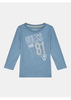 Guess Bluzka N4BI18 I3Z14 Niebieski Regular Fit ze sklepu MODIVO w kategorii Bluzki dziewczęce - zdjęcie 181196729