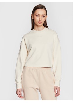 New Balance Bluza Athletics Nature WT23555 Écru Relaxed Fit ze sklepu MODIVO w kategorii Bluzy damskie - zdjęcie 181199305