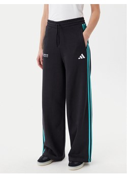 adidas Spodnie dresowe Mercedes - AMG Petronas Formula One Team DNA JV5432 Czarny Regular Fit - id: 0000304819872 - marki adidas - 181201936 adidas Spodnie dresowe Mercedes - AMG Petronas Formula One Team DNA JV5432 Czarny Regular Fit ze sklepu MODIVO w kategorii Spodnie damskie - zdjęcie 181201936