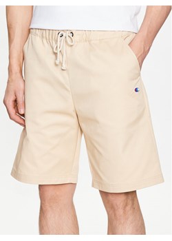 Champion Szorty materiałowe 217239 Beżowy Relaxed Fit ze sklepu MODIVO w kategorii Spodenki męskie - zdjęcie 181202009
