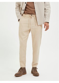Selected Homme Chinosy 16087636 Beżowy Slim Tapered Fit ze sklepu MODIVO w kategorii Spodnie męskie - zdjęcie 181203716