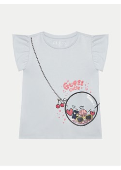 Guess T-Shirt K5GI05 K6YW4 Błękitny Regular Fit ze sklepu MODIVO w kategorii Bluzki dziewczęce - zdjęcie 181208618