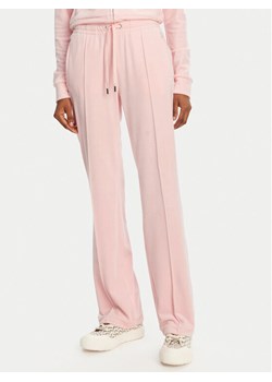 Juicy Couture Spodnie dresowe Tina JCAPW045 Różowy Regular Fit ze sklepu MODIVO w kategorii Spodnie damskie - zdjęcie 181939687