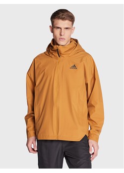 adidas Kurtka przejściowa Traveer RAIN.RDY Jacket (Gender Neutral) HG6013 Beżowy Regular Fit ze sklepu MODIVO w kategorii Kurtki męskie - zdjęcie 182594275
