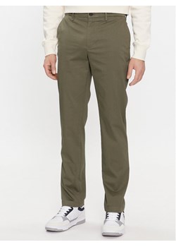 Tommy Hilfiger Chinosy Denton MW0MW33938 Khaki Slim Fit ze sklepu MODIVO w kategorii Spodnie męskie - zdjęcie 182595109