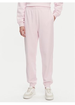 Tommy Hilfiger Spodnie dresowe WW0WW45576 Różowy Regular Fit - id: 0000304674464 - marki Tommy Hilfiger - 182596567 Tommy Hilfiger Spodnie dresowe WW0WW45576 Różowy Regular Fit ze sklepu MODIVO w kategorii Spodnie damskie - zdjęcie 182596567