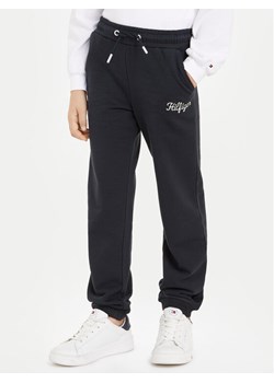 Tommy Hilfiger Spodnie dresowe NY KG0KG08108 Granatowy Regular Fit ze sklepu MODIVO w kategorii Spodnie chłopięce - zdjęcie 182597219