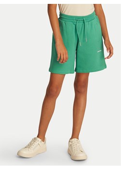 Calvin Klein Jeans Szorty sportowe New Inst. Logo IU0IU00703 Zielony Relaxed Fit ze sklepu MODIVO w kategorii Spodenki dziewczęce - zdjęcie 182597295