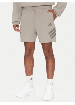 adidas Szorty sportowe Future Icons 3-Stripes JD4882 Beżowy Regular Fit ze sklepu MODIVO w kategorii Spodenki męskie - zdjęcie 182600215