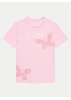 Guess T-Shirt J4GI20 K8HM4 Różowy Regular Fit ze sklepu MODIVO w kategorii Bluzki dziewczęce - zdjęcie 182600585