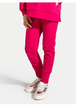 Coccodrillo Spodnie dresowe ZC4120201VGA Różowy Slim Fit ze sklepu MODIVO w kategorii Spodnie dziewczęce - zdjęcie 182604276