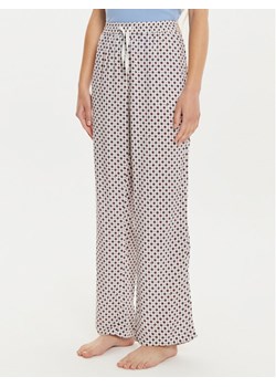 Tommy Hilfiger Spodnie piżamowe UW0UW05225 Écru Regular Fit ze sklepu MODIVO w kategorii Piżamy damskie - zdjęcie 182604829