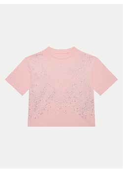 Guess T-Shirt J5RI13 K6YW4 Różowy Boxy Fit ze sklepu MODIVO w kategorii Bluzki dziewczęce - zdjęcie 182605099