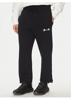 Nike Spodnie dresowe FB7127 Czarny Standard Fit ze sklepu MODIVO w kategorii Spodnie męskie - zdjęcie 182605697
