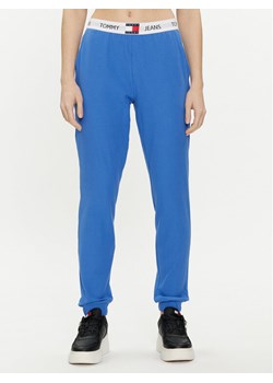Tommy Jeans Spodnie dresowe UW0UW05154 Niebieski Regular Fit ze sklepu MODIVO w kategorii Spodnie damskie - zdjęcie 182606496