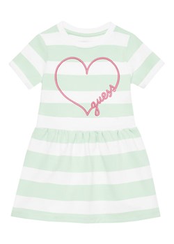 Guess Sukienka codzienna K5GK28 KBOR4 Zielony Regular Fit ze sklepu MODIVO w kategorii Sukienki dziewczęce - zdjęcie 182608027