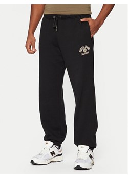 Guess Spodnie dresowe M5RB52 KCPR1 Czarny Regular Fit ze sklepu MODIVO w kategorii Spodnie męskie - zdjęcie 182608349