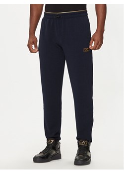 EA7 Emporio Armani Spodnie dresowe 7M000030 AF10344 UB102 Granatowy Regular Fit ze sklepu MODIVO w kategorii Spodnie męskie - zdjęcie 182610199