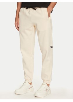 EA7 Emporio Armani Spodnie dresowe 6DPP58 PJVTZ 1713 Beżowy Regular Fit ze sklepu MODIVO w kategorii Spodnie męskie - zdjęcie 182611878
