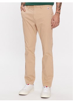 Tommy Jeans Chinosy Austin DM0DM18339 Beżowy Slim Fit ze sklepu MODIVO w kategorii Spodnie męskie - zdjęcie 182613499