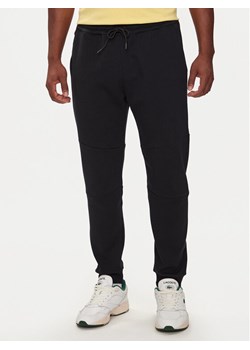 Lacoste Spodnie dresowe XH0011R Czarny Regular Fit ze sklepu MODIVO w kategorii Spodnie męskie - zdjęcie 182617177