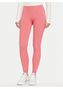 Guess Legginsy V4YB00 Z3F90 Różowy Slim Fit ze sklepu MODIVO w kategorii Spodnie damskie - zdjęcie 182618585