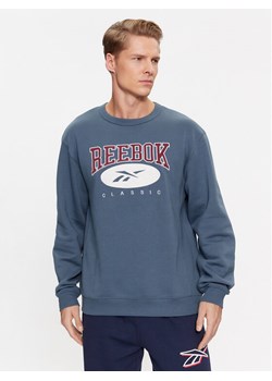 Reebok Bluza Archive Essentials IM1531 Niebieski Regular Fit ze sklepu MODIVO w kategorii Bluzy męskie - zdjęcie 182619077