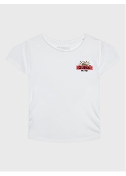Guess T-Shirt J3RI20 K6YW1 Biały Regular Fit ze sklepu MODIVO w kategorii Bluzki dziewczęce - zdjęcie 182619935
