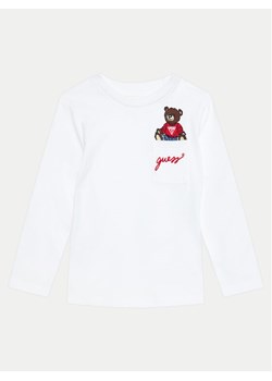 Guess Bluzka N4BI06 I3Z13 Biały Regular Fit - id: 0000304236433 - marki Guess - 182620265 Guess Bluzka N4BI06 I3Z13 Biały Regular Fit ze sklepu MODIVO w kategorii Bluzki dziewczęce - zdjęcie 182620265