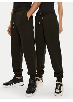 AMI PARIS Spodnie dresowe UTR240.JE0091 Brązowy Regular Fit ze sklepu MODIVO w kategorii Spodnie męskie - zdjęcie 182623567