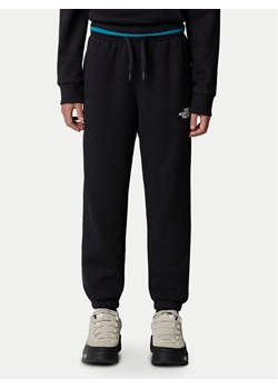 The North Face Spodnie dresowe NF0A8BHT Czarny Regular Fit ze sklepu MODIVO w kategorii Spodnie chłopięce - zdjęcie 182625427