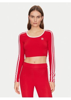 adidas Bluzka adicolor 3-Stripes JD4626 Czerwony Slim Fit ze sklepu MODIVO w kategorii Bluzki damskie - zdjęcie 182626249