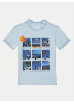 Guess T-Shirt L5GI11 K8HM4 Błękitny Regular Fit ze sklepu MODIVO w kategorii T-shirty chłopięce - zdjęcie 182626536