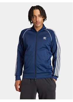 adidas Bluza adicolor Classics SST IR9866 Niebieski Slim Fit ze sklepu MODIVO w kategorii Bluzy męskie - zdjęcie 182628137