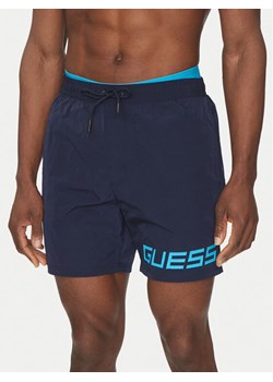 Guess Szorty kąpielowe F5GT12 WH1C2 Granatowy Regular Fit ze sklepu MODIVO w kategorii Kąpielówki - zdjęcie 182628429