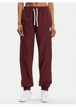 Converse Spodnie dresowe Star Printer 10026055-A02 Bordowy Tapered Fit ze sklepu MODIVO w kategorii Spodnie damskie - zdjęcie 182628435