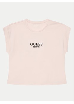 Guess T-Shirt J4BI34 J1314 Różowy Boxy Fit ze sklepu MODIVO w kategorii Bluzki dziewczęce - zdjęcie 182629349