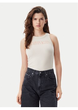 Calvin Klein Jeans Top Varsity J20J225520 Beżowy Slim Fit ze sklepu MODIVO w kategorii Bluzki damskie - zdjęcie 182629899