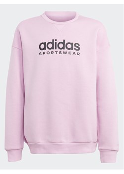 adidas Bluza Fleece IL4930 Różowy Loose Fit ze sklepu MODIVO w kategorii Bluzy dziewczęce - zdjęcie 182635236