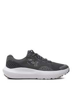 Under Armour Buty UA BGS Surge 4 3027103-101 Szary ze sklepu MODIVO w kategorii Buty sportowe dziecięce - zdjęcie 182636067