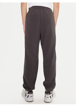 Champion Spodnie dresowe 220419 Szary Regular Fit ze sklepu MODIVO w kategorii Spodnie męskie - zdjęcie 182636626