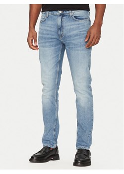HUGO Jeansy 50537685 Niebieski Slim Fit ze sklepu MODIVO w kategorii Jeansy męskie - zdjęcie 182637148